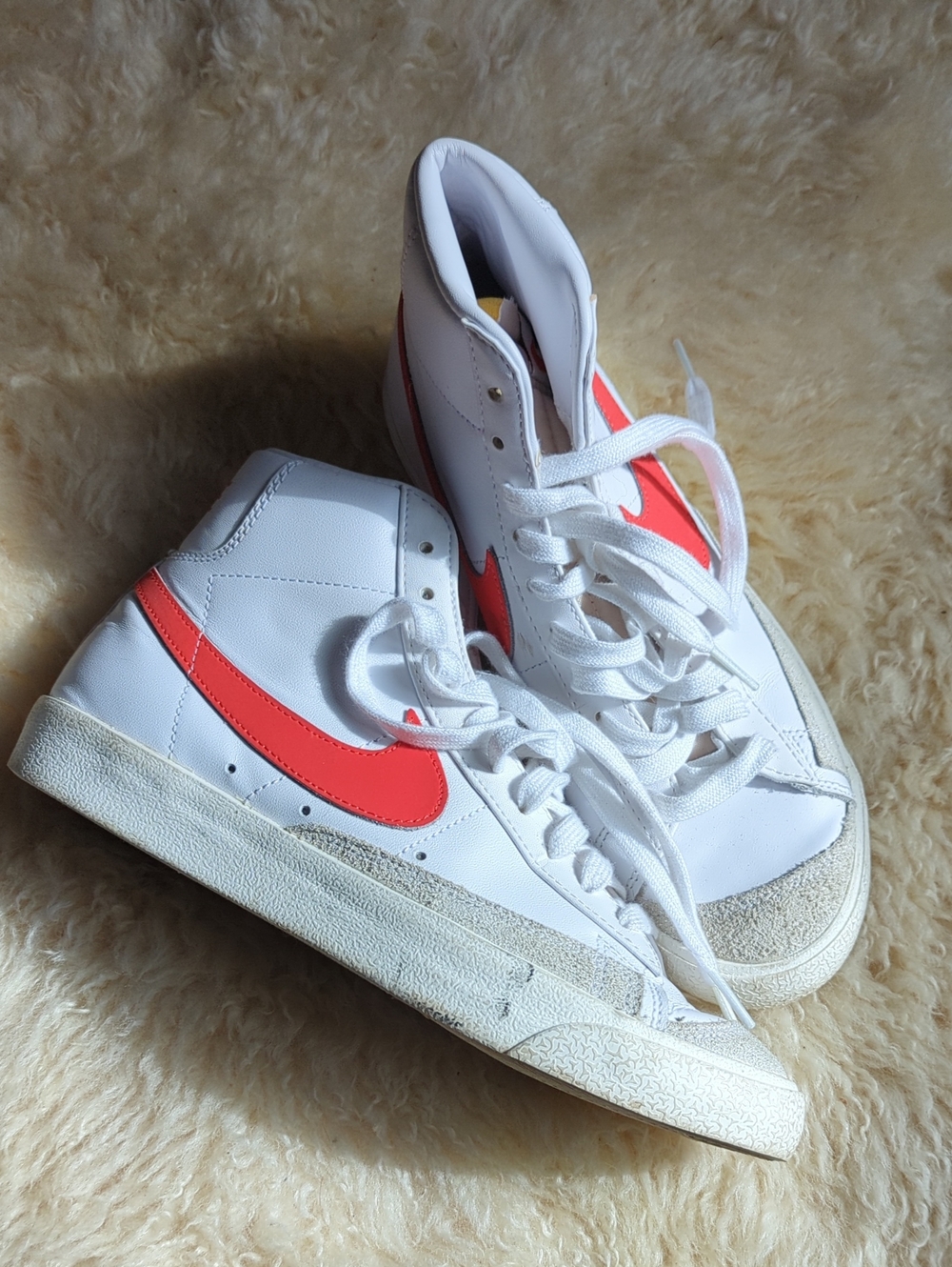 Nike Women’s White High-Top Sneakers with Red Swoosh